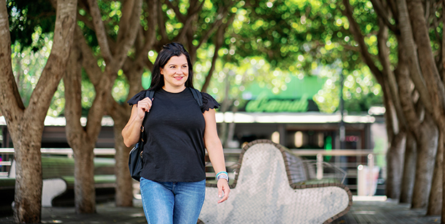 Victoria Vartuli walking around ACU Blacktown Campus