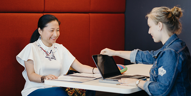 Happy students in ACU Brisbane library