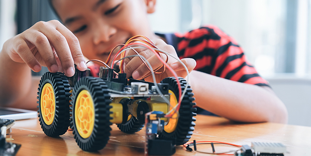 Boy plays with toy truck