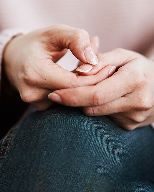 Woman worrying her fingernails