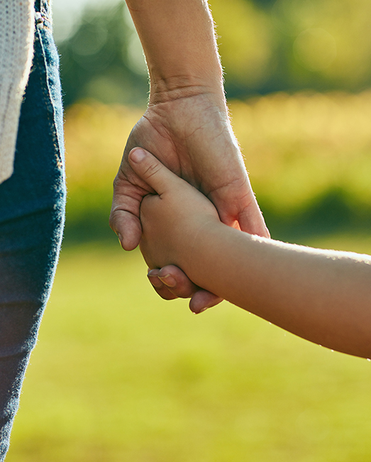 Mother and child holding hands