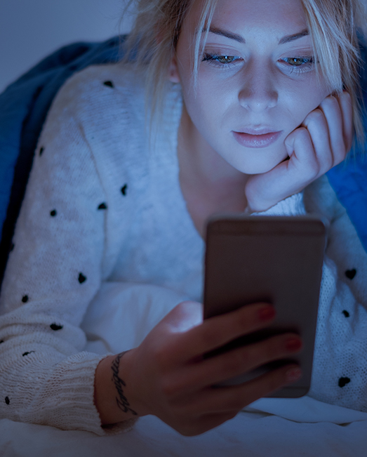 Young woman looking at smartphone