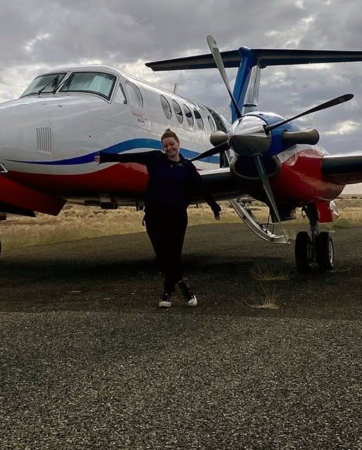Madison Mills in Broken Hill with RFDS plane.