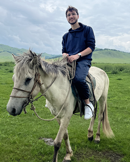 Angelo Groza on a horse in Mongolia.