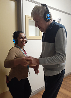 Uniting Care staff member with resident Mike