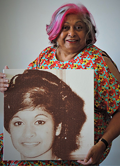 Julie Appo holds picture of her younger self