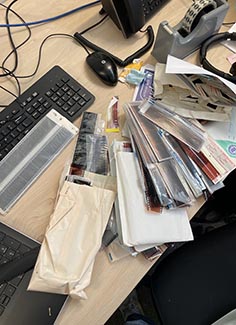 Negatives from photographs on a desk
