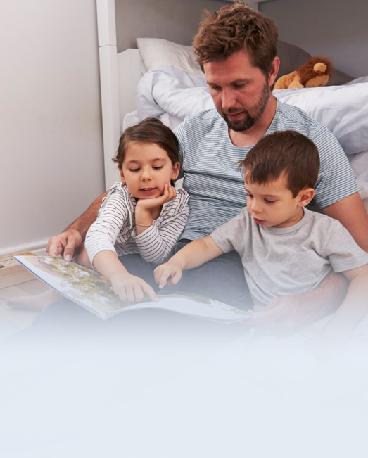 Dad reading to his kids