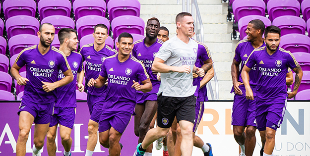 Alex warming up with team