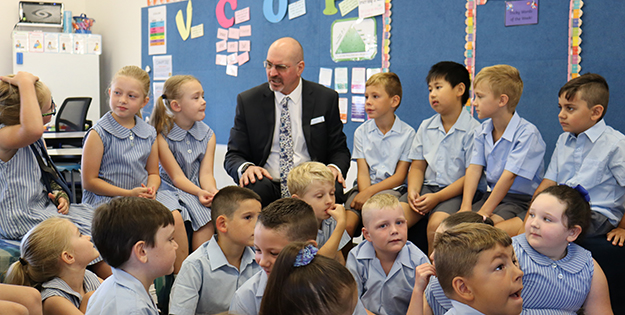 Dr Jake Madden and students