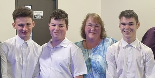 Lynda Trovato and her three sons.