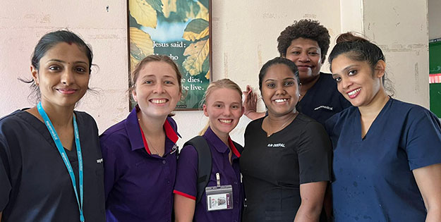 ACU student nurses alongside local Fijian nurses.
