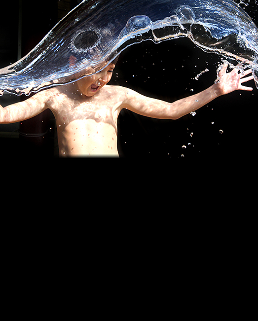 Child playing with water